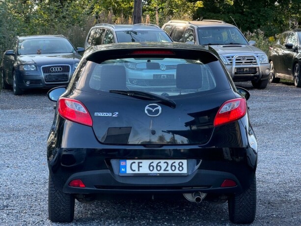 mazda-2-bensin-2012-big-3